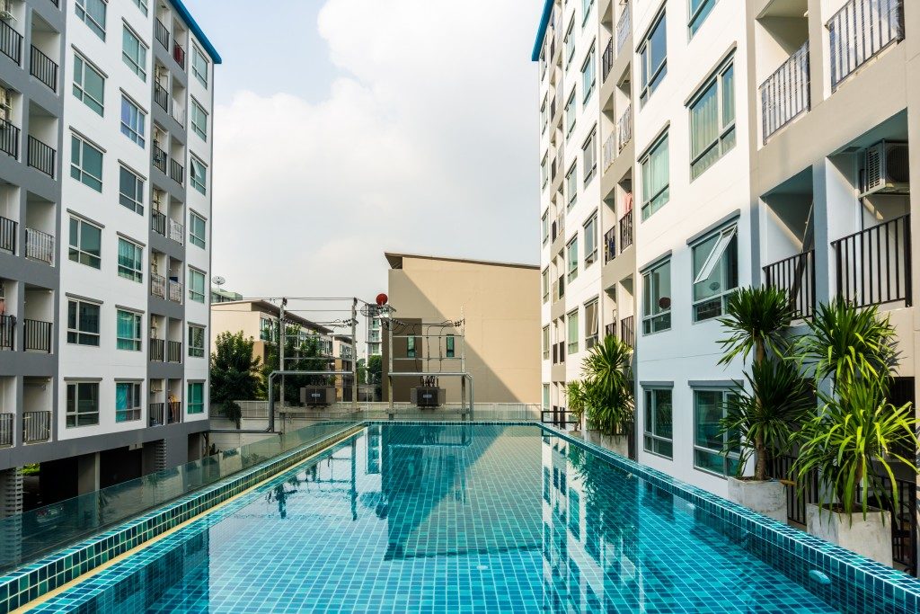 Swimming pool among high rise condo buildings