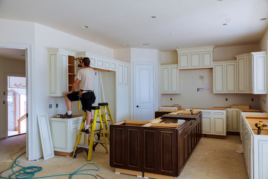 man remodeling kitchen