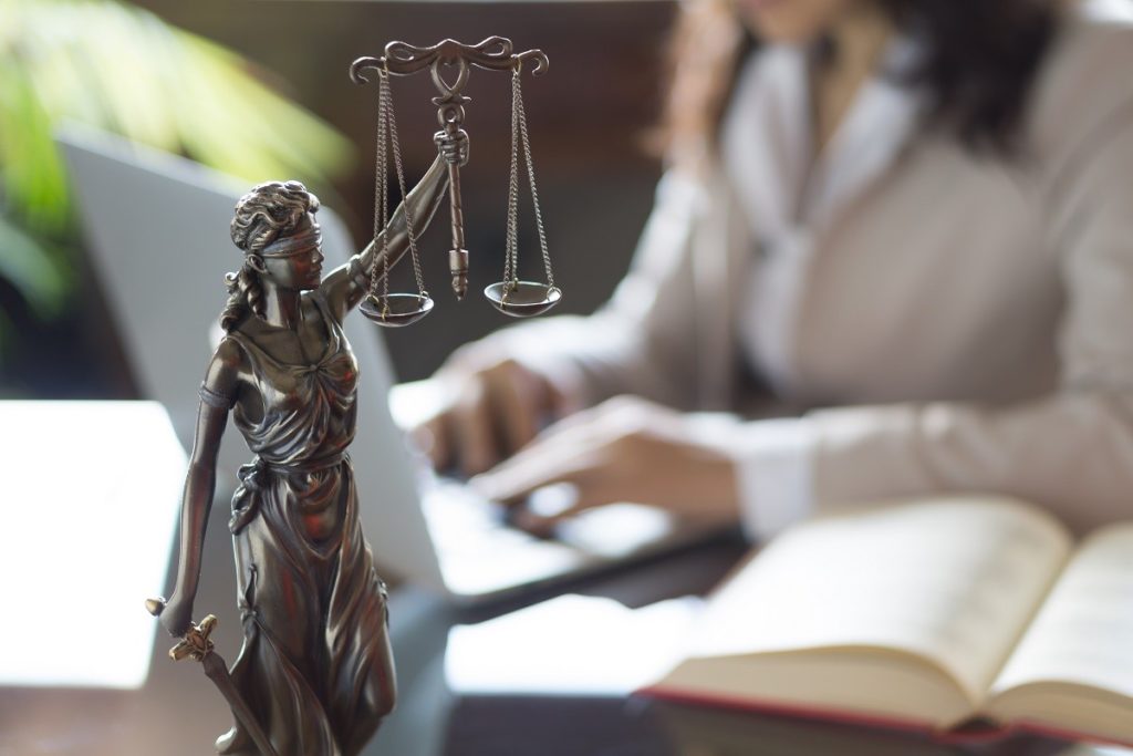 Law professional working with a statue on the table