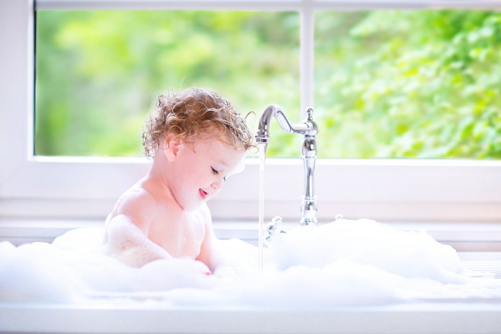 baby taking a bubble bath