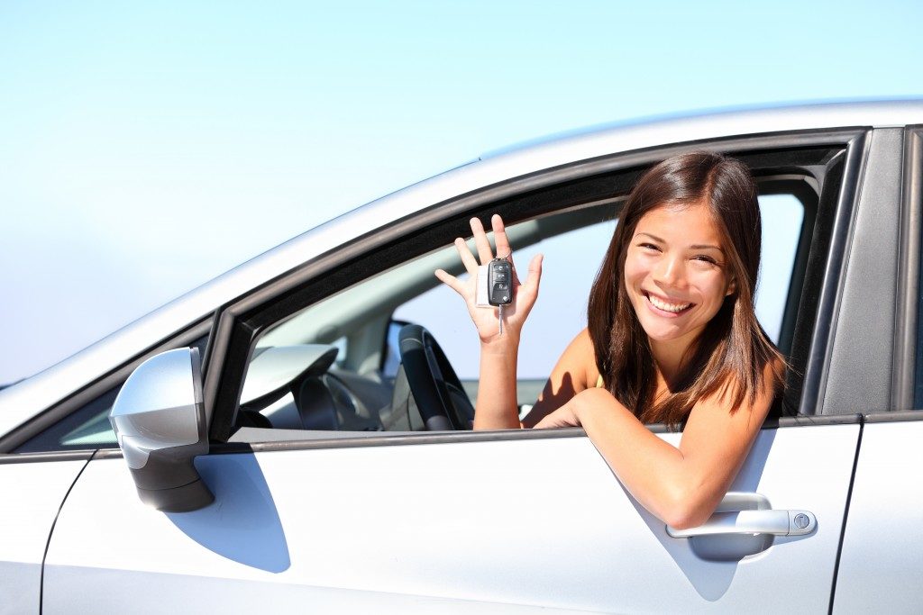 woman inside her newly bought car