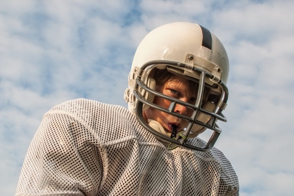 young football player wearing mouthgard