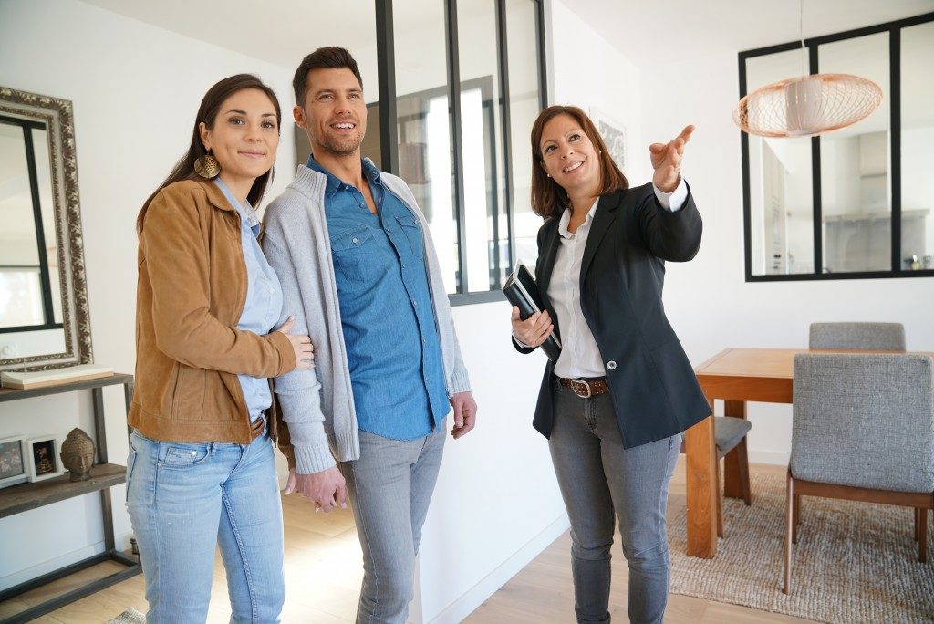 realtor showing the couple a house