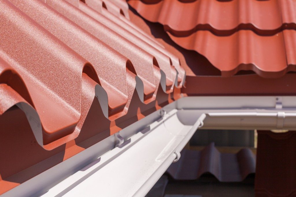 red metal tile with white rain gutter