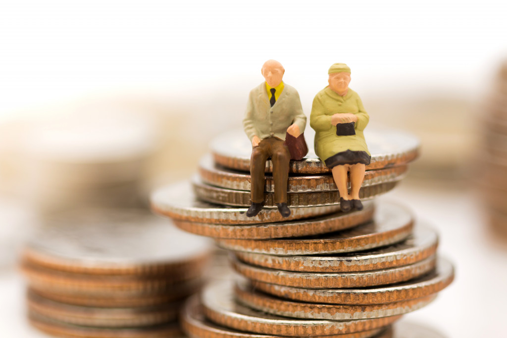 senior couple on top of a cascaded coins