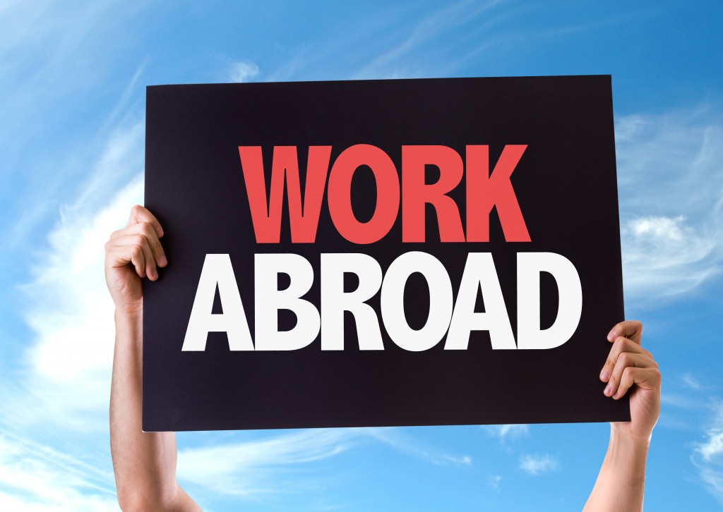 signage of work abroad
