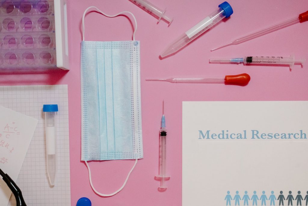 Medical Supplies on Pink Background