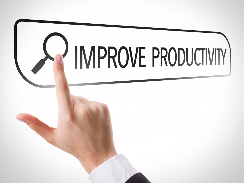 a businessman pointing improve productivity written in the screen