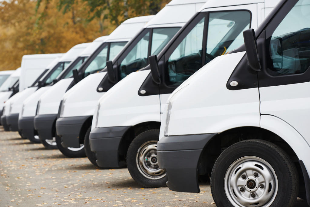 An image of commercial delivery vans at a parking lot