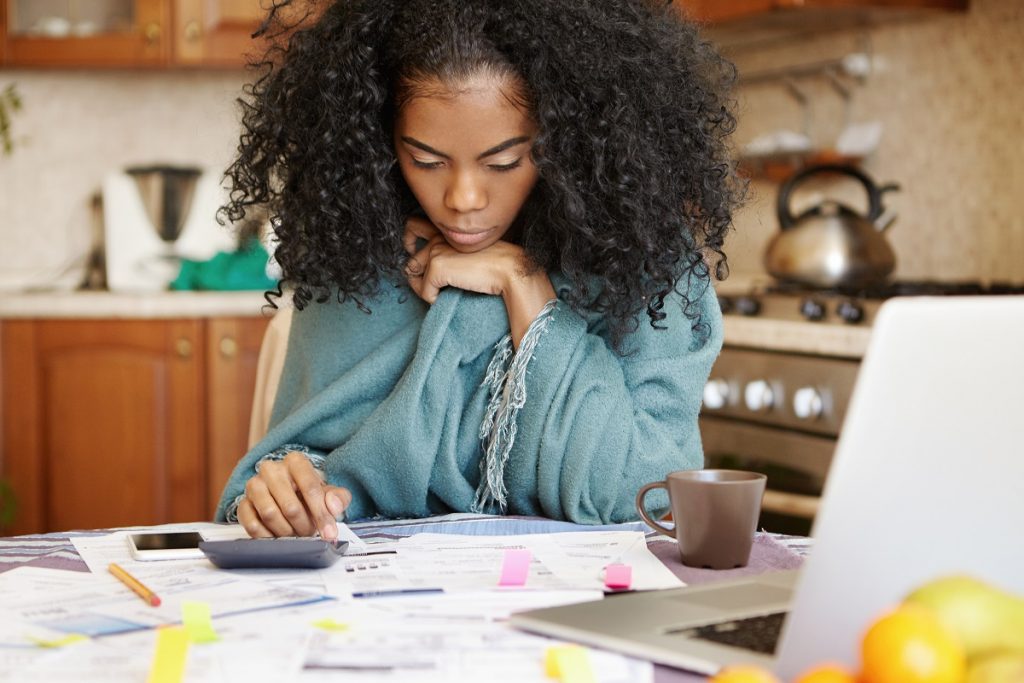 a woman calculating finances